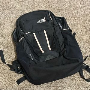 North face back pack, like new! Pink accents